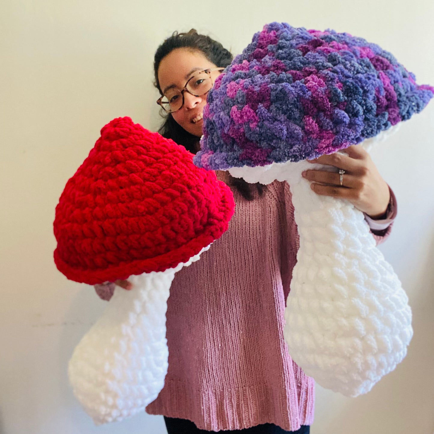 red mushroom pillow and purple mushroom pillow