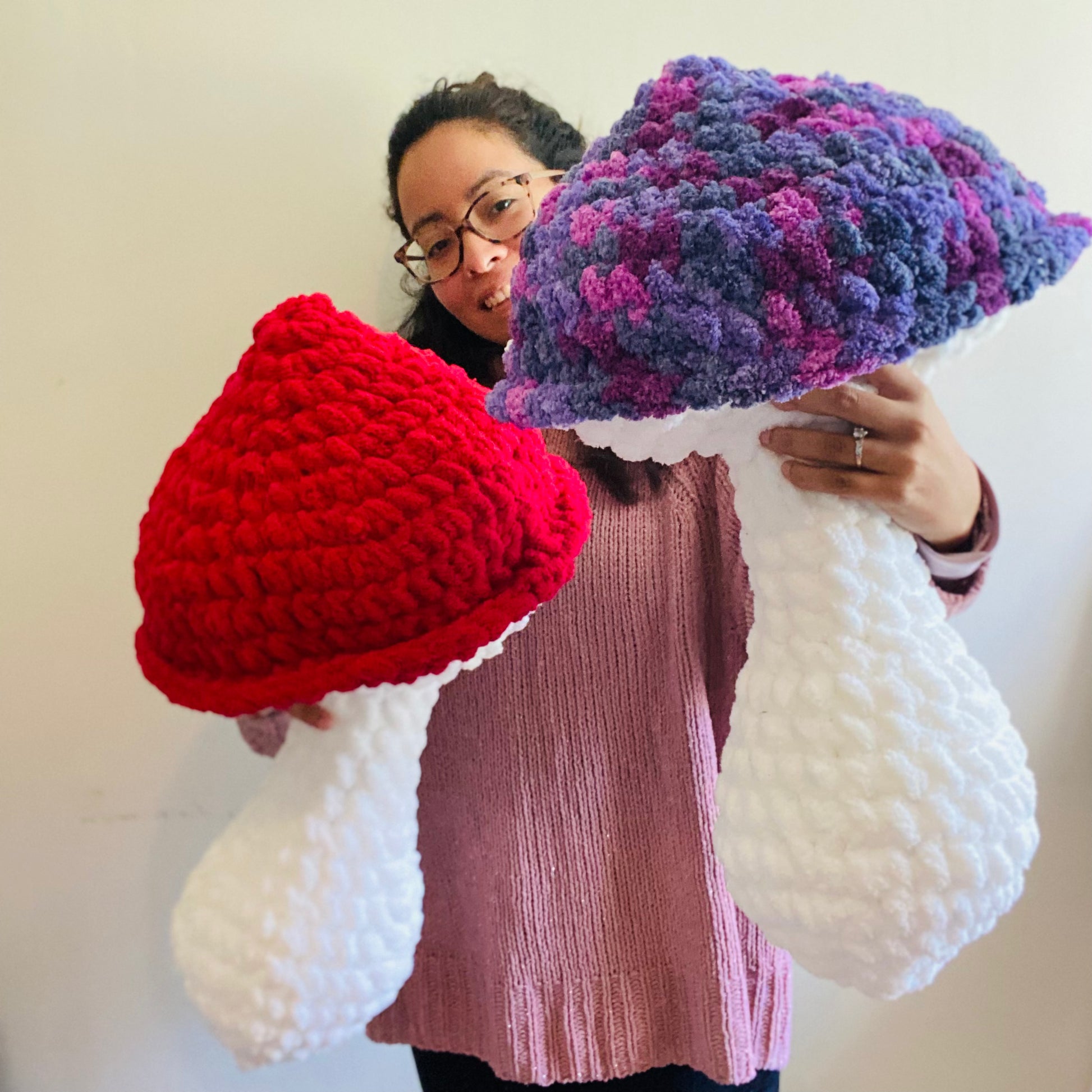 red mushroom pillow and purple mushroom pillow