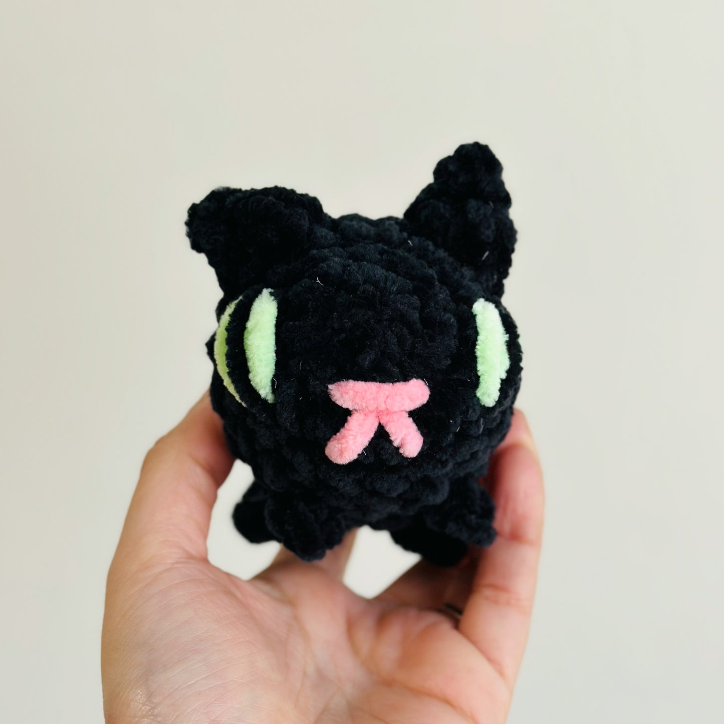 black cat with green eyes stuffed animal